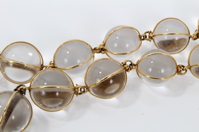 Lot 505 - Antique crystal bead necklace with 23 graduated spherical beads cased in gold wire cages on a gold clasp, 46cm