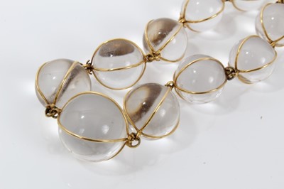 Lot 505 - Antique crystal bead necklace with 23 graduated spherical beads cased in gold wire cages on a gold clasp, 46cm