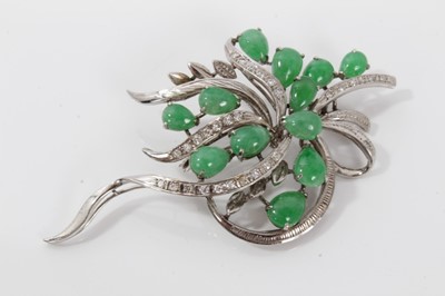 Lot 510 - 1960s Chinese 18K white gold diamond and jade floral spray brooch with twelve pear shape green jade cabochons, brilliant cuts in 18K white gold setting. 65mm