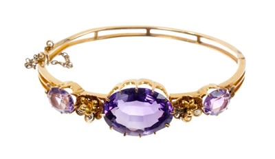 Lot 465 - Ladies gold and amethyst bangle