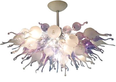 Lot 1368 - In the style of Dale Chihuly (American, born 1941), an impressive hand-blown sculptural glass ceiling light with purple, pink, white frosted and clear glass shades, approximately 100cm diameter. Th...