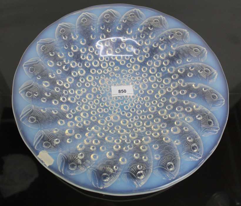 Lot 850 - Rene Lalique, a Roscoff glass charger/bowl, model 10-383, designed circa 1932, blue opalescent with bubbles and fish, engraved R Lalique France to centre, 36cm diameter