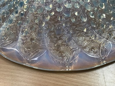 Lot 850 - Rene Lalique, a Roscoff glass charger/bowl, model 10-383, designed circa 1932, blue opalescent with bubbles and fish, engraved R Lalique France to centre, 36cm diameter