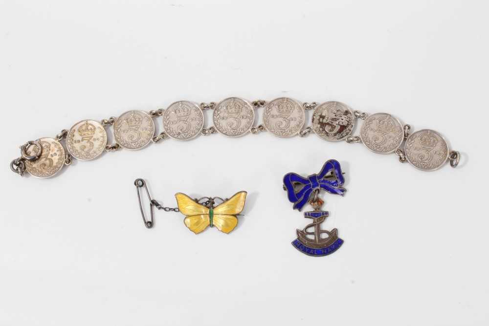 Lot 16 - Silver and yellow guilloché enamel butterfly brooch, silver and enamel Royal Navy sweetheart brooch and a silver three-penny coin bracelet