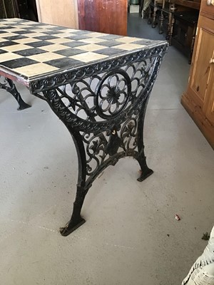Lot 71 - Cast iron garden table with chequered tiled top