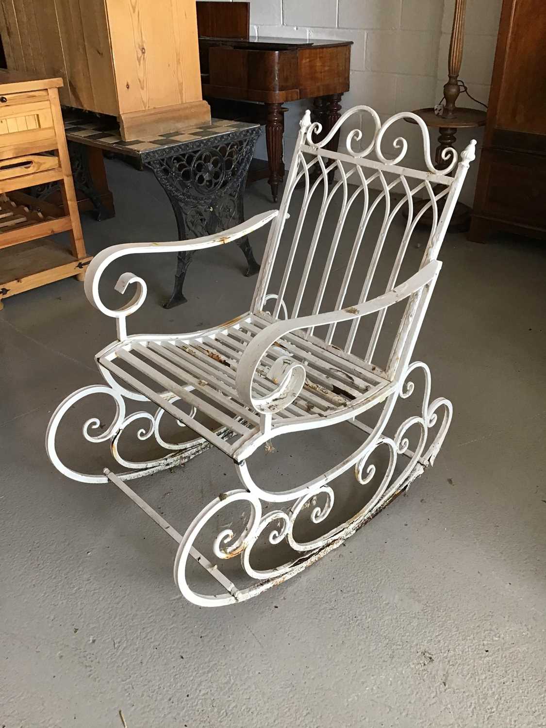 Lot 72 - White painted wrought metal gothic rocking garden chair