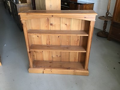 Lot 77 - Pine open bookcase and a pine cupboard with two drawers