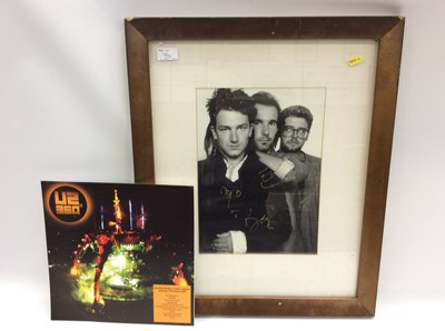 Lot 984 - Original U2 photograph signed by all 4 members plus U2 360 purple vinyl LP, White Label promo