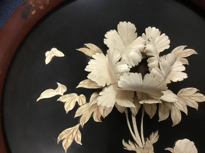 Lot 176 - Japanese carved bone and lacquered circular plaque, in high relief with Chrysanthemum and butterfly