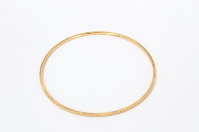 Lot 207 - Four Eastern gold bangles