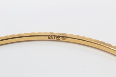 Lot 207 - Four Eastern gold bangles