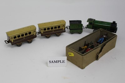 Lot 1469 - Railway Mettoy tin plate train in box together with lead soldiers