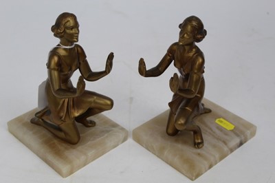 Lot 1995 - Pair of Art Deco style gilt patinated speller bookends, in the form of kneeling women, on alabaster bases, 17.5cm height