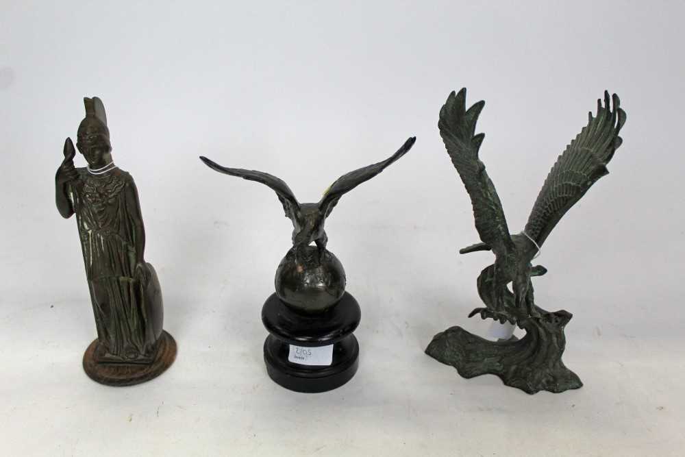 Lot 2105 - Two spelter figures of eagles, and a brass classical figure (3)