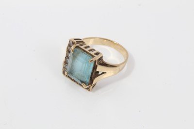 Lot 155 - 9ct gold blue stone and diamond dress ring and a green hard stone ring