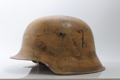 Lot 680 - Second World War Nazi Wehrmacht M40 Pattern steel helmet, in camouflage painted finish, believed to be ex. Italian campaign