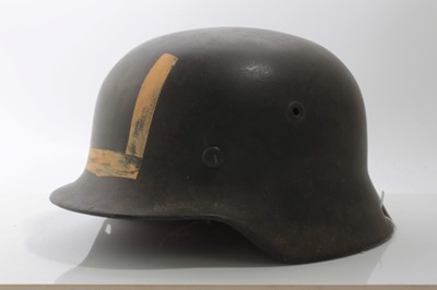 Lot 688 - Second World War Nazi M40 pattern steel helmet in grey painted finish, with luminous painted 'U' to front, tan leather lining stamped in ink '58', underside of helmet stamped NS66, DN44, rivets sta...