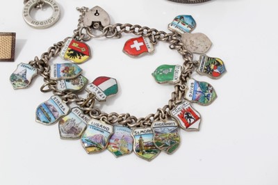 Lot 41 - Continental silver and enamel souvenir charm bracelet, other silver jewellery and two silver napkin rings