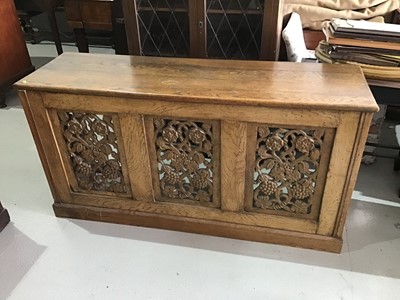 Lot 25 - Oak hall unit with three carved panels on the front decorated with vines, flowers and berries
