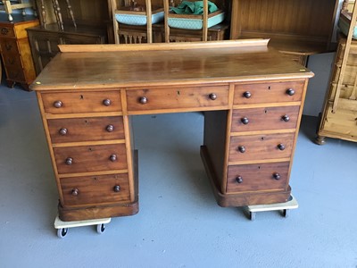 Lot 39 - Victorian mahogany kneehole desk with an arrangement of nine drawers below H70cm W130cm D60.5cm