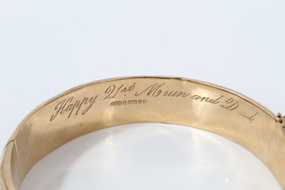 Lot 51 - 9ct gold hinge bangle with geometric and scroll decoration