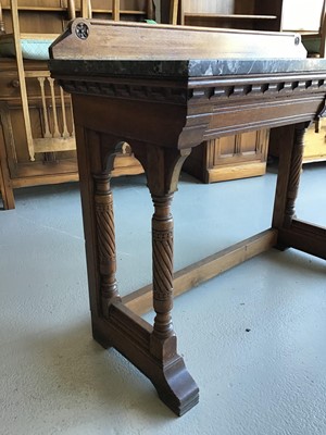 Lot 47 - Victorian oak marble topped tall table with ledge back two drawers below on carved supports H83cm W114cm D47cm
