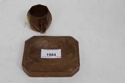 Lot 1984 - Robert 'Mouseman' Thompson of Kilburn, carved oak napkin ring of Octagonal form with resting mouse decoration, together with a small Oak Ashtray in the style of Mouseman (2)