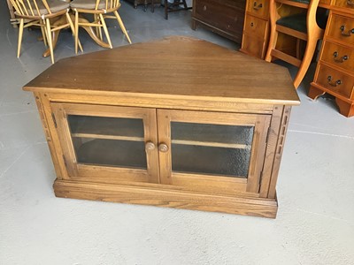 Lot 60 - Ercol corner television cabinet/stand with two glazed doors below enclosing one adjustable shelf H55cm W96cm D73cm