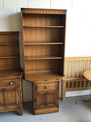 Lot 66 - Ercol elm two height bookcase with three opened shelves above single drawer and cupboard below H196.5cm W80cm D50cm