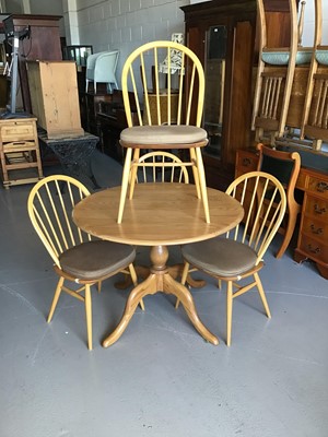 Lot 67 - Ercol round breakfast table together with four Ercol stick back chairs, table H73.5cm W100cm
