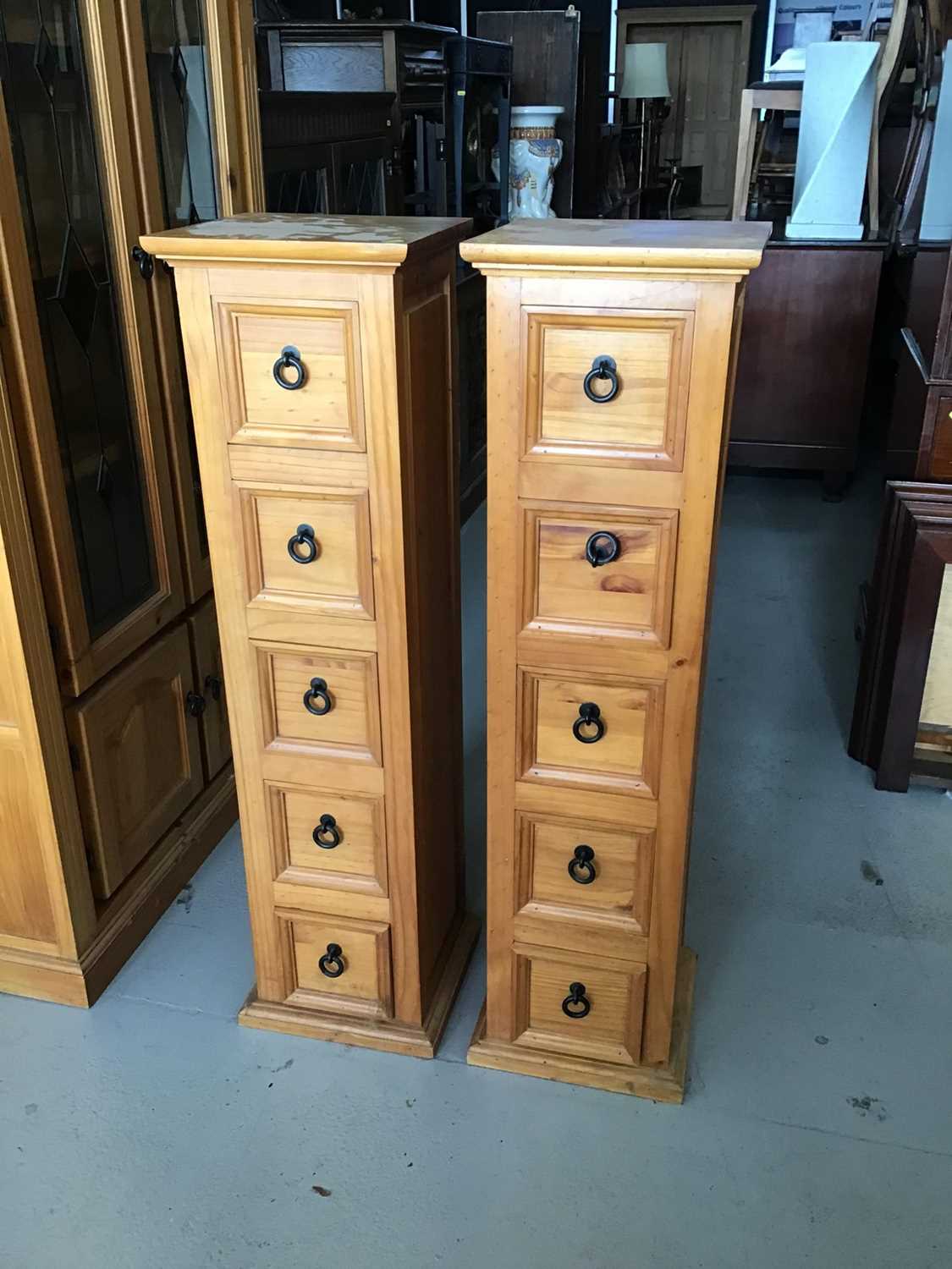 Lot 69 - Pair of stained pine narrow chests with five drawers and metal looped handles H120cm W33cm D30cm