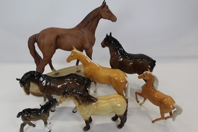 Lot 940 - Five Beswick horses including Highland Pony and two Royal Doulton horses