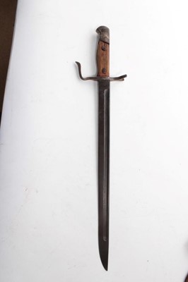 Lot 752 - Second World War Japanese Arisaka type 30 bayonet, with an unusual quillion (lacking scabbard), together with two hunting knives, a Malayan Kris and a miniature Kukri. (5)