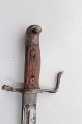 Lot 752 - Second World War Japanese Arisaka type 30 bayonet, with an unusual quillion (lacking scabbard), together with two hunting knives, a Malayan Kris and a miniature Kukri. (5)
