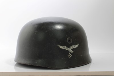 Lot 698 - Second World War Nazi Luftwaffe Fallschirmjager (Paratroopers) Steel Combat Helmet, with single Luftwaffe decal, stamped under brim 756 and E, 68, with brown leather lining and straps.