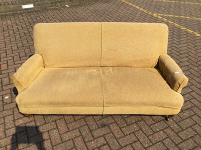 Lot 85 - Old two seater sofa with removable cover modern turned front legs and low scroll arms H80cm W180cm D90cm