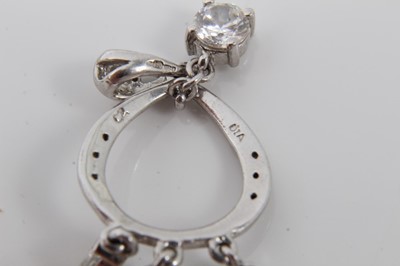 Lot 99 - Two 9ct white gold diamond and synthetic white stone pendants