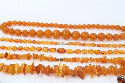 Lot 112 - Silver and amber bangle and other amber jewellery