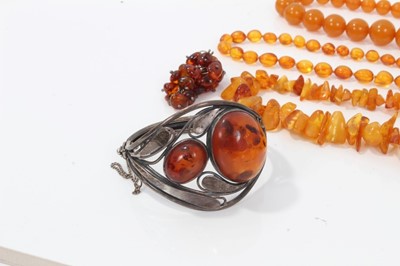 Lot 112 - Silver and amber bangle and other amber jewellery