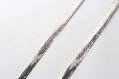 Lot 759 - Pair Wilkinson Sword society swords with cruciform hilts and etched blades