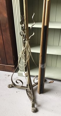 Lot 124 - Brass standard lamp with cream shade on scroll paw feet together with a selection of snooker cues