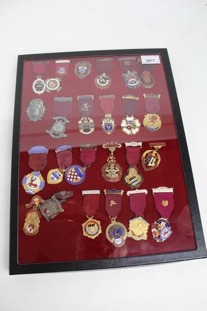 Lot 2017 - A glass case containing 24 assorted Masonic jewels