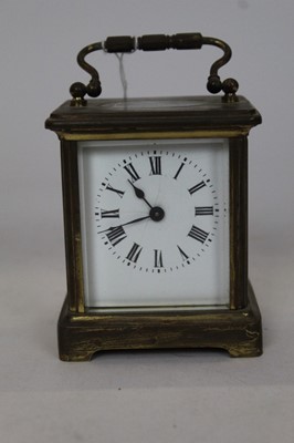 Lot 2092 - Brass carriage clock with white enamel dial