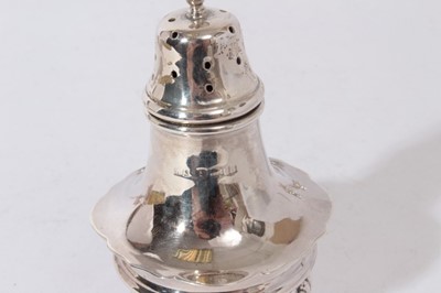 Lot 328 - George V silver cruet set of cauldron form, raised on three splayed paw feet, comprising two mustard pots, two pepperettes and two salt casters (Birmingham 1926), all at 8.5oz (8 pieces)