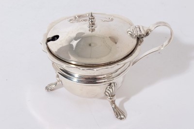 Lot 328 - George V silver cruet set of cauldron form, raised on three splayed paw feet, comprising two mustard pots, two pepperettes and two salt casters (Birmingham 1926), all at 8.5oz (8 pieces)