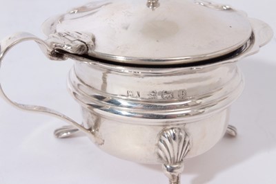 Lot 328 - George V silver cruet set of cauldron form, raised on three splayed paw feet, comprising two mustard pots, two pepperettes and two salt casters (Birmingham 1926), all at 8.5oz (8 pieces)