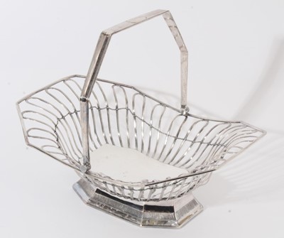 Lot 243 - 19th century silver plated cake basket of octagonal form with open wire frame and swing handle, raised on flared foot with pierced decoration, apparently unmarked, 34cm in overall length