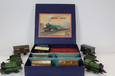 Lot 1507 - Railway Hornby 0 gauge clock work template train set 0-4-0 1842 locomotive LNER tender and 3 carriages in a 501 passenger box, plus Hornby 8851 0-4-0 locomotive & tender and other rolling stock & w...