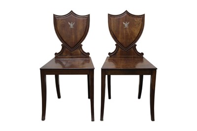 Lot 1214 - Fine pair of Regency mahogany hall chairs with painted crest.