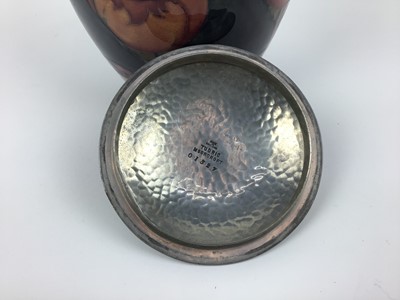 Lot 18 - Moorcroft pewter mounted biscuit barrel decorated in the poppy pattern on blue and green ground
